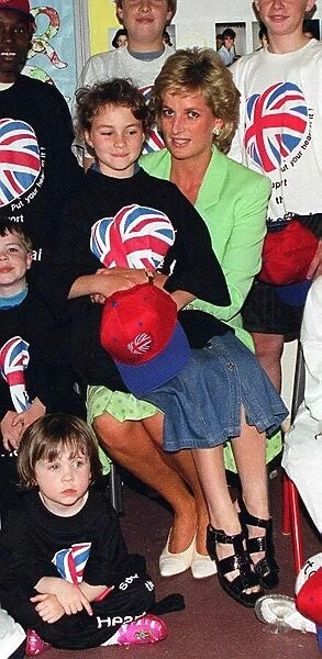 Princess Diana with Danielle Stephenson sitting on her knee during a visit to