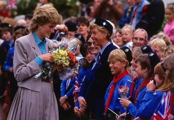 Princess Diana, the Princess of Wales, at Galloway receiving flowers from Girl Guides