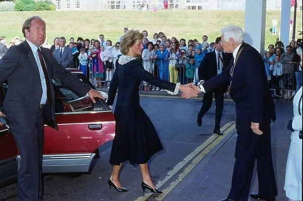 Princess Diana, Princess of Wales shaking hands while visiting Aberdeen, Scotland