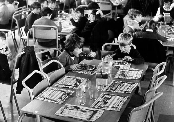 Pupils at Gracemount Primary School in Edinburgh, sit down to school dinner