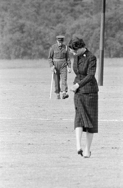 Queen Elizabeth II stamping down the earth on a Polo field Household Brigades Polo