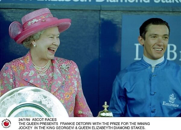Queen Elizabeth presents Frankie Dettori with the prize for the winning jockey in