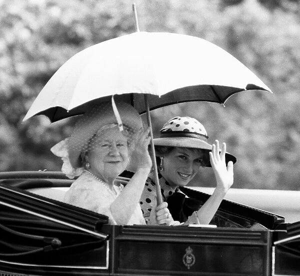 The Queen Mother and Princess Diana wave from their open carriage as they attend Royal
