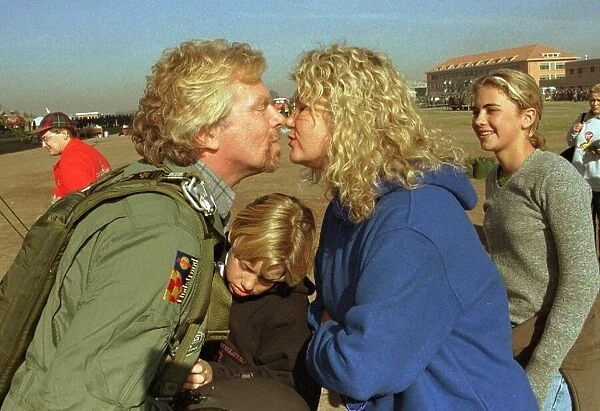 Richard Branson about to board the Virgin Global Challenger balloon is kissed by wife