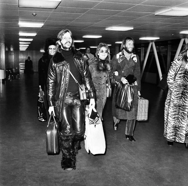 Ringo starr pictured with Lulu and her husband at Heathrow Airport