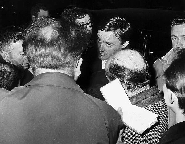 Robert Vaughn actor surrounded by members of the press