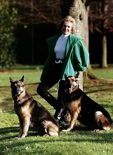 Rosemary Conley UK diet & fitness expert poses for a photograph while exercising her pet