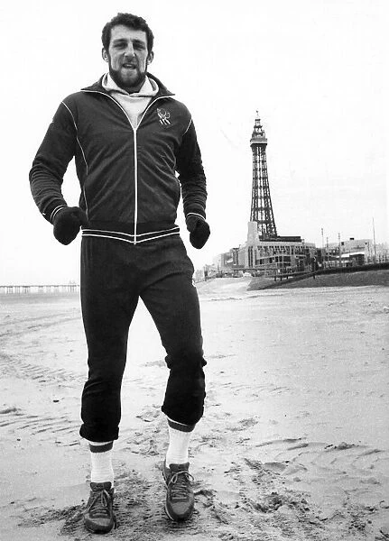 Rugby Union player and policeman Wade Dooley training on the beach at Blackpool