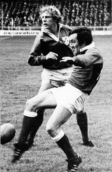 Rugby - Wales v Ireland - Phil Bennett kicks into space for Wales - 1978