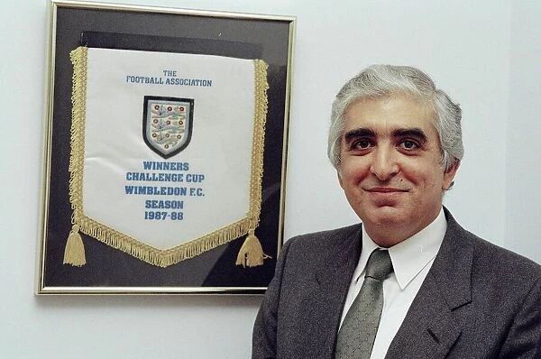 Sam Hammam, chairman of Wimbledon Football Club. He stands proudly in front of