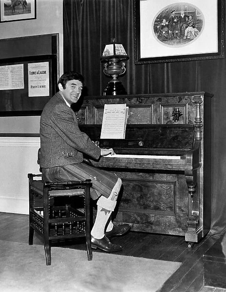 Scottish comedian Jimmy Logan playing the piano inside Culzean castle