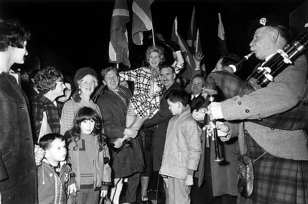 Scottish Nationalist MP Winnie Ewing arrives at Kings Cross Station in London with her