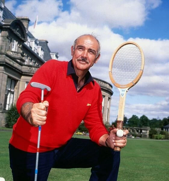 Sean Connery holding tennis raquet and golf club August 1981