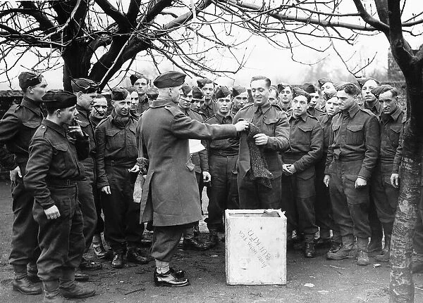 Sergeant Major issuing comforts to soldiers of the Suffolk Regiment