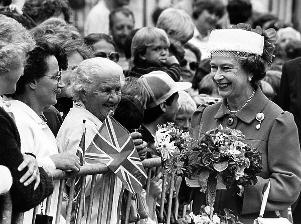 A smile from the Queen during her walkabout in Montgomery, Wales. 12th July 1986