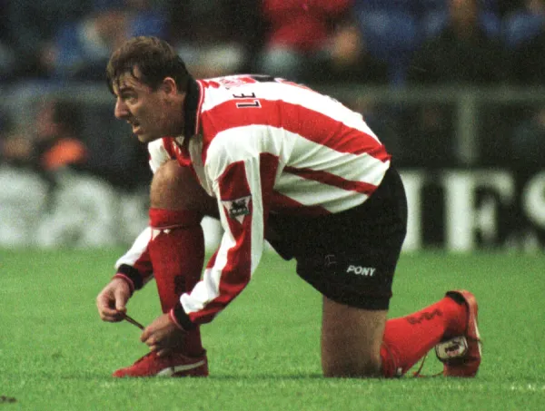 Southampton footballer Matthew Le Tissier putting on red boots during his side