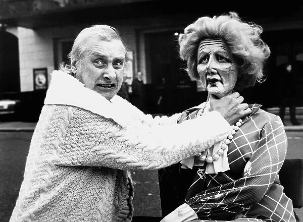 Spike Milligan strangling a doll of Margaret Thatcher with his hands November 1982