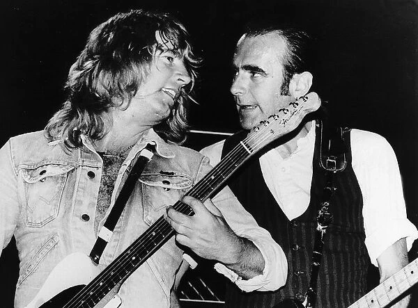Status Quo POP Group Rick Parfitt and Francis Rossi singing on stage