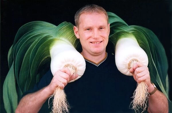 Steve White with his giant prize winning leeks in September 1994