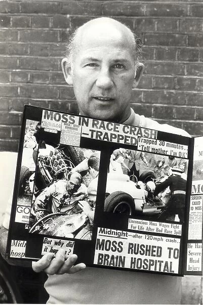 stirling moss with cuttings of his crash aug 1982 -----
