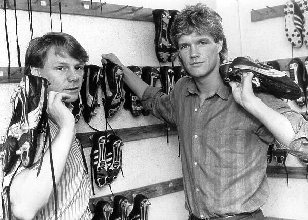Stuart Pearce(left) and Ian Butterworth collect their boots from the training ground