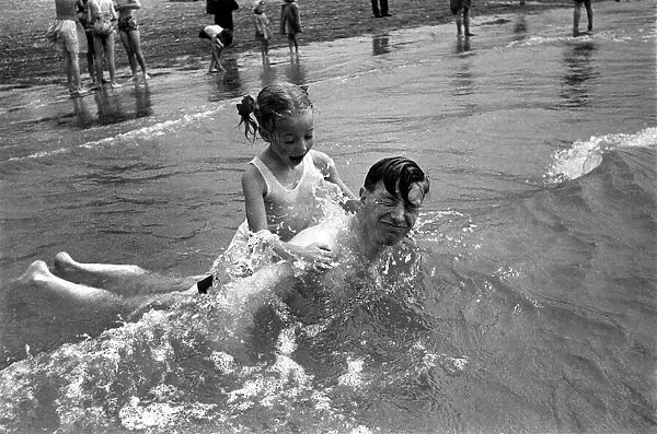 In surf at Brighton - Gladys Tester. August 1952 C3867