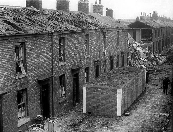 The surface street air raid shelters stand intact following a German raid on the North