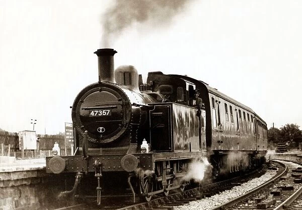 A tank engine arriving at a rural English train station on a preservation line circa 1990