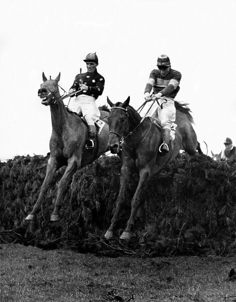 Teal (Jockey in spotted shirt) and Legal joy take the last fence in the 1952 Grand