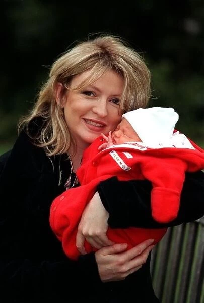 Television Presenter Caron Keating holding baby Gabriel January 1997