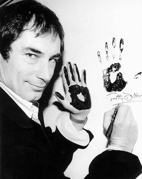 Timothy Dalton actor makes his mark in the Wall of Fame at the Theatre Museum in Londons