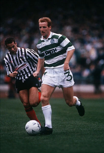 Tommy Burns runs past George O Boyle November 1989