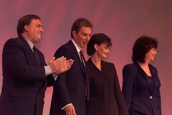 Tony Blair MP and Cherie Blair September 1999 is applauded by John Prescott after
