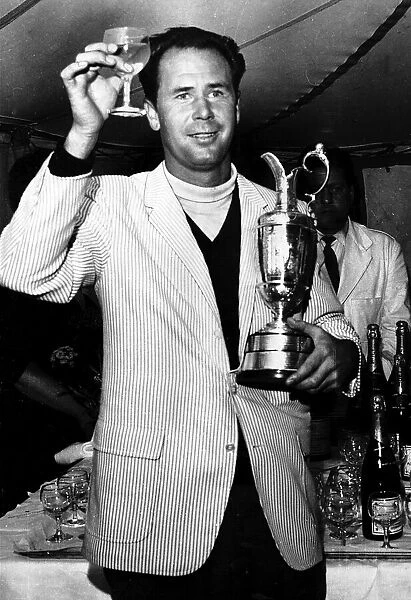 Tony Herne holding a glass of champagne and the British Golf Open trophy