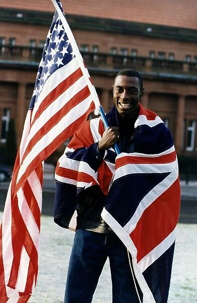 Tony Jarrett athlete runner with American and British flags at Kelvin Hall Glasgow