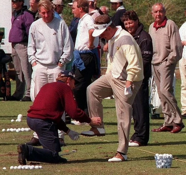 Tony Johnstone holds foot of Lee Westwood July 1998 before he kisses it Open Golf