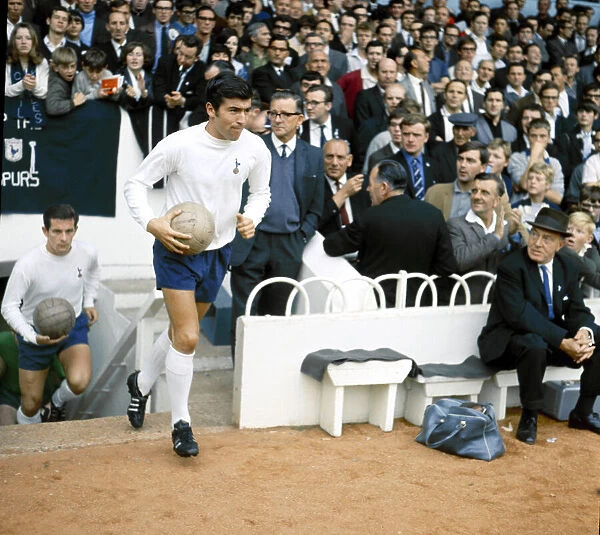 Tottenham Hotspur footballer Terry Venables walk out of the tunnel before his side