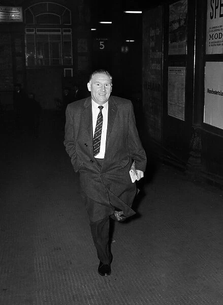 Tottenham Hotspur manager Bill Nicholson hurries out of Preston Station as he tries to
