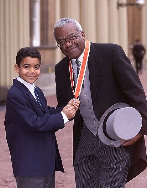 TREVOR McDONALD NOVEMBER 1999 WITH SON JACK AFTER BEING KNIGHTED AT BUCKINGHAM