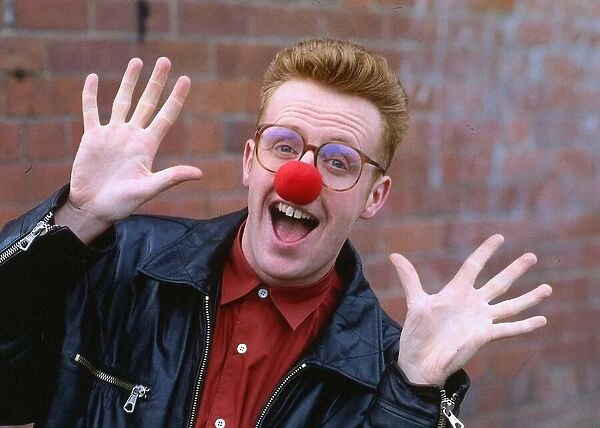 TV presenter Bryan Burnett wearing a red nose 1990