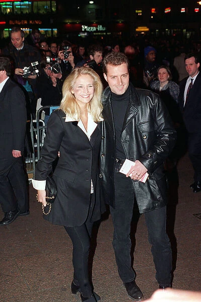 Ulrika Jonsson TV Presenter with John Turnbull 1994 at the film premiere of Waynes