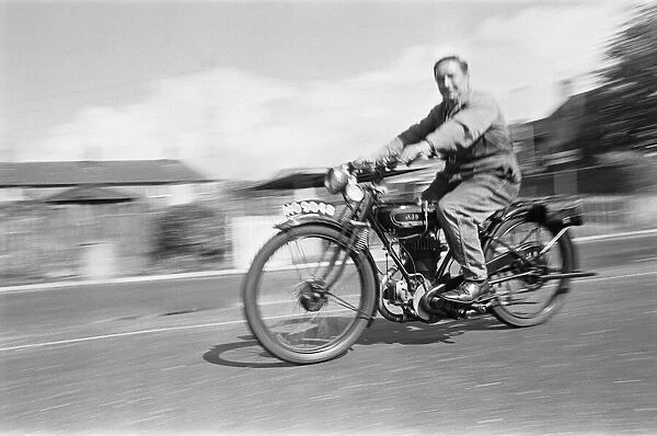 A vintage motorbike enthusiast out for a Sunday ride on his 1928 AJS Motorcycle at