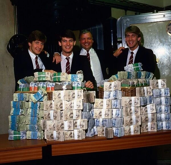 Wallace Mercer & players with pile of money February 1986