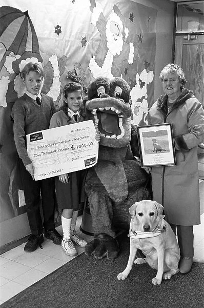 Wellhouse Middle School, Mirfield present a cheque to Guide Dogs for the Blind