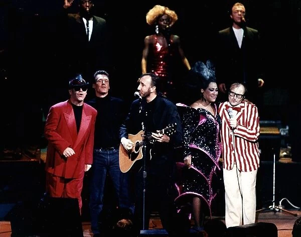 The Who pop group with various singers Elton John singer left in red suit