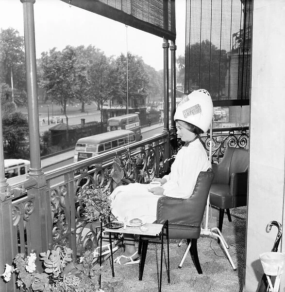 Woman Hairdressers A Client at Mr Freddie Frenchs Park lane balcony hairdressing