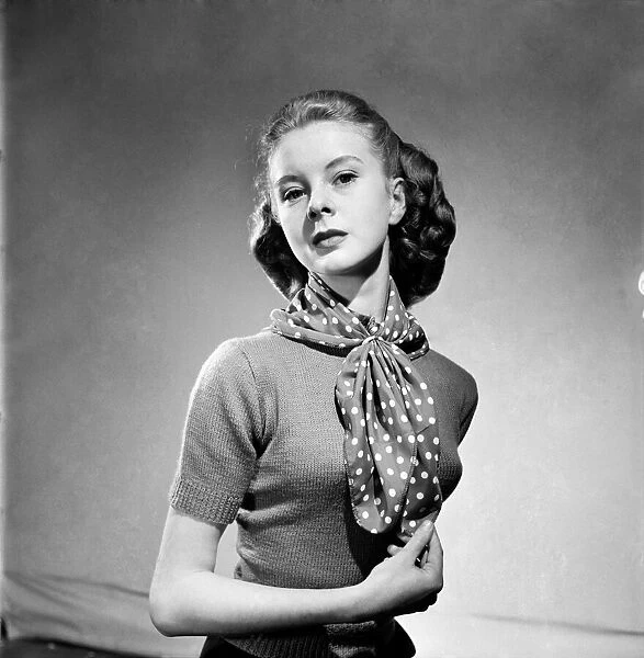Women modelling an adaptable scarf. June 1952 C3240-001