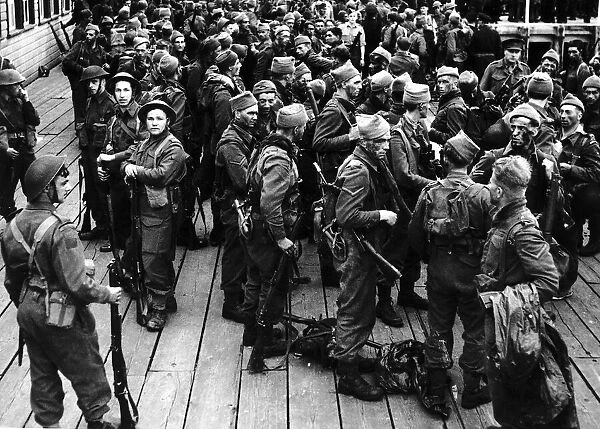 WW2 Troops on the quayside August 1942 after returning from the biggest ever