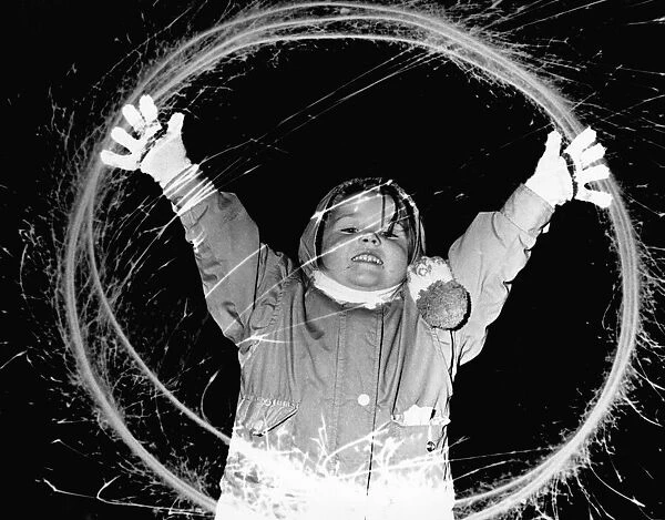 Four year old Laura Bowen, of Anfield, having fun with a sparkler. 5th November 1991