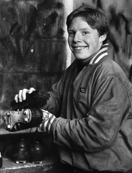 Young Liverpool footballer Sammy Lee getting his boots ready for the next match
